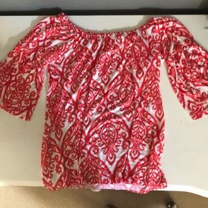 red and white patterned blouse